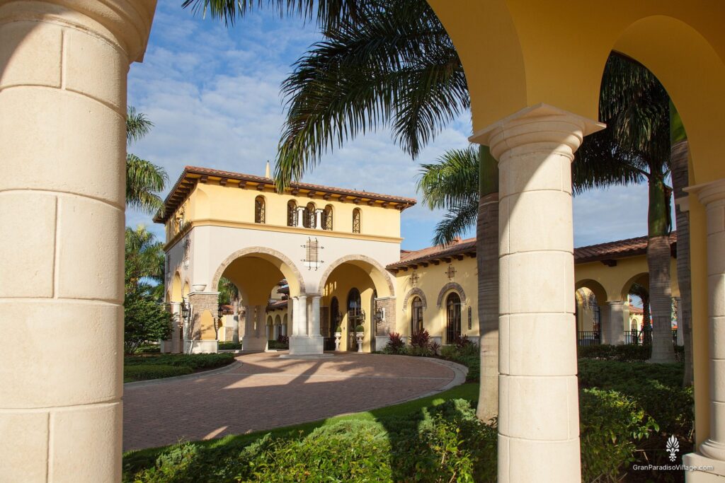 View through stone arches to the Gran Paradiso clubhouse courtyard in Wellen Park