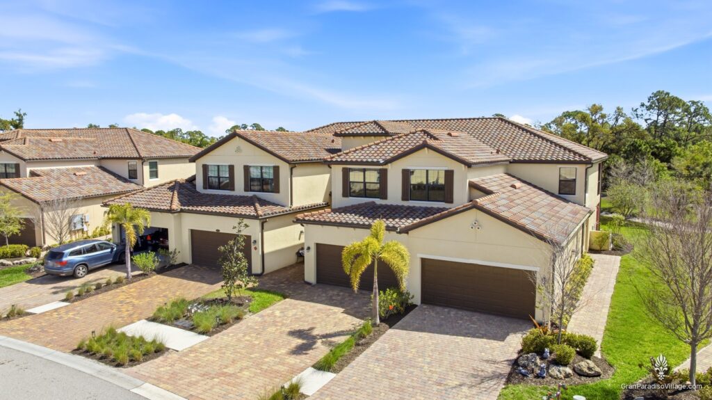 Wellen Park Gran Paradiso coach home with tile roofs and paver driveways