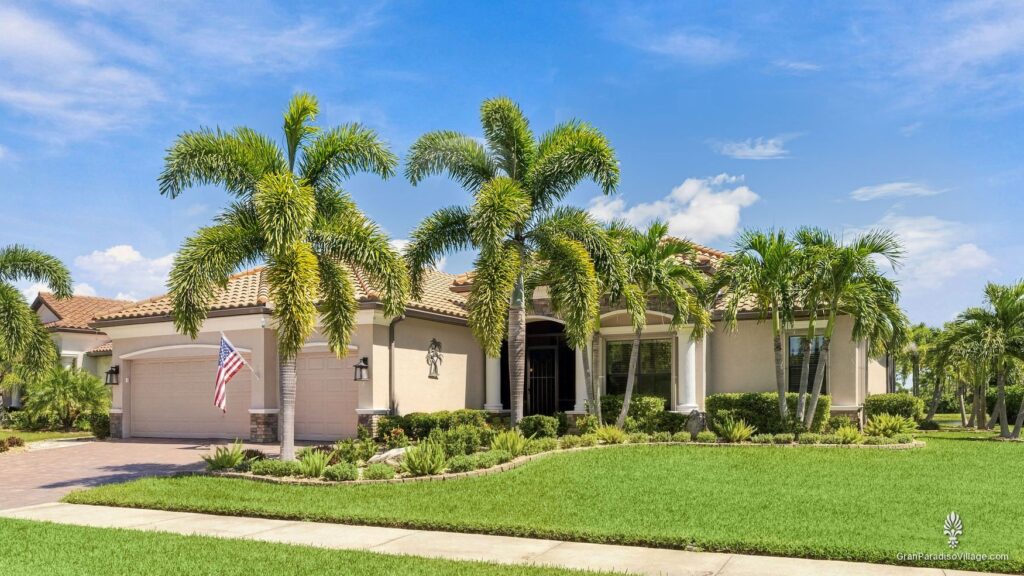 Wellen Park Gran Paradiso estate home with royal palms and a landscaped lawn