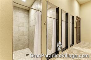 Private shower stalls in a Gran Paradiso clubhouse locker room in Wellen Park