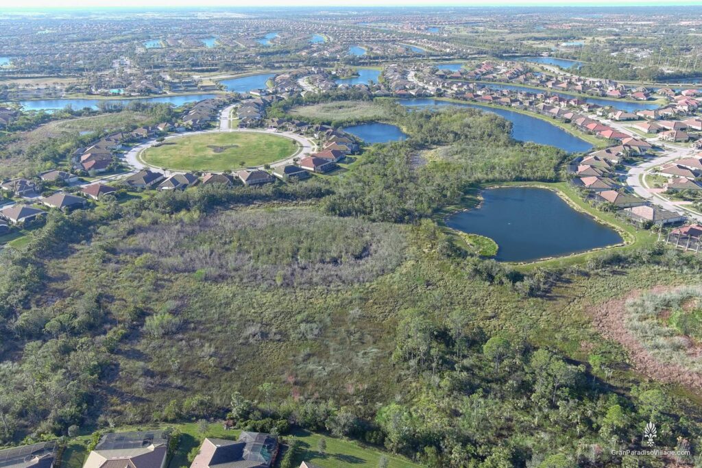 Wellen Park aerial of Gran Paradiso homes bordered by preserve, lakes and a circular green