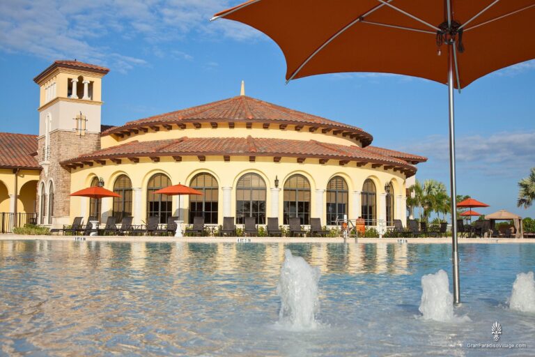 Gran Paradiso resort pool with fountains, umbrellas and the clubhouse bell tower in Wellen Park