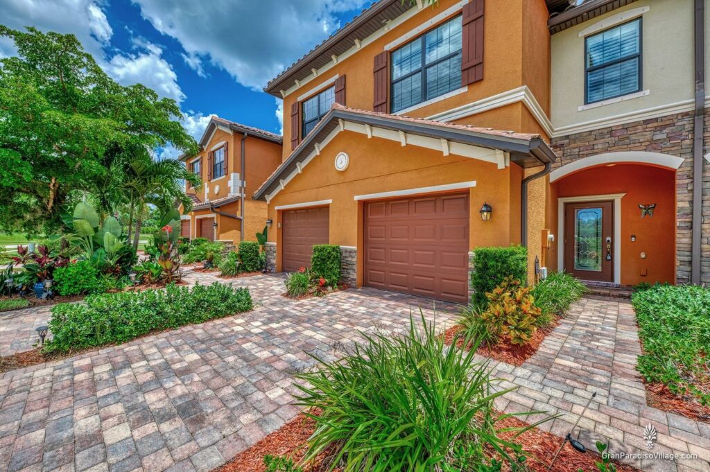 Wellen Park Gran Paradiso townhome building with garages and paver drives