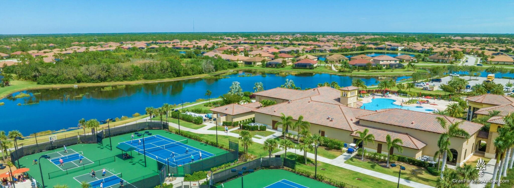 Aerial of Gran Paradiso's lakes, preserve and finished neighborhood around the clubhouse in Wellen Park