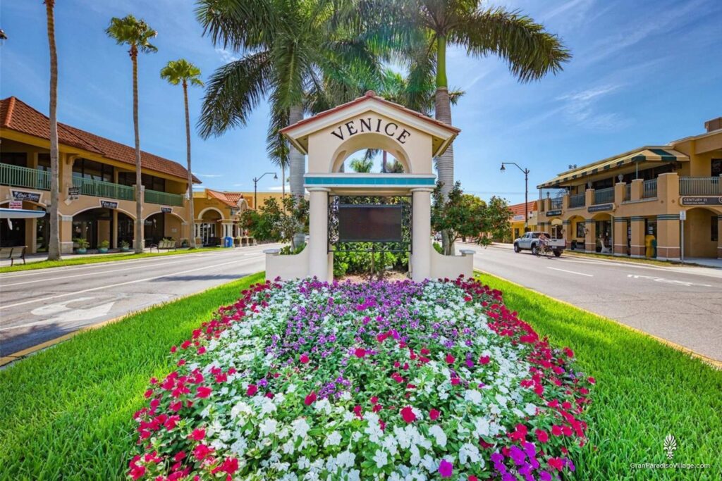Venice sign and flower bed in historic downtown Venice, a short drive from Gran Paradiso in Wellen Park
