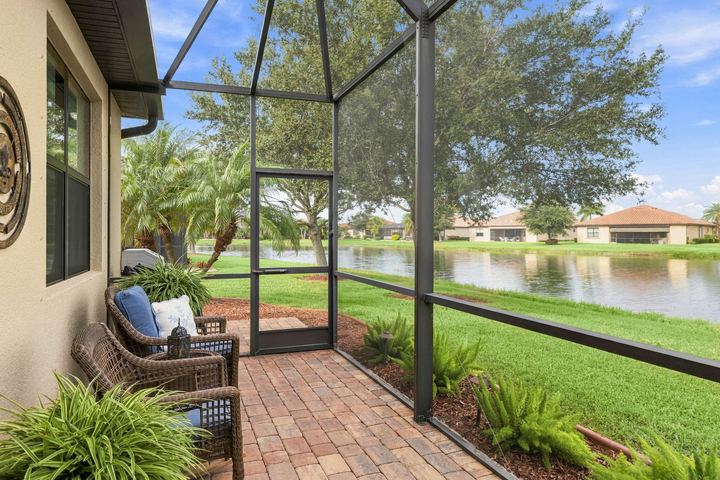 Screened lanai overlooking the pond at 20297 Tesoro Dr in Gran Paradiso