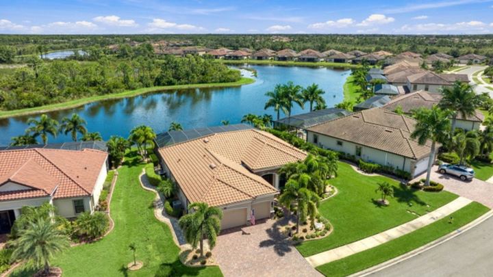 Aerial view of 20734 Valprato Ct on the pond in Gran Paradiso