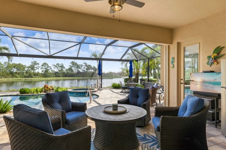 Covered lanai overlooking pool, spa and pond