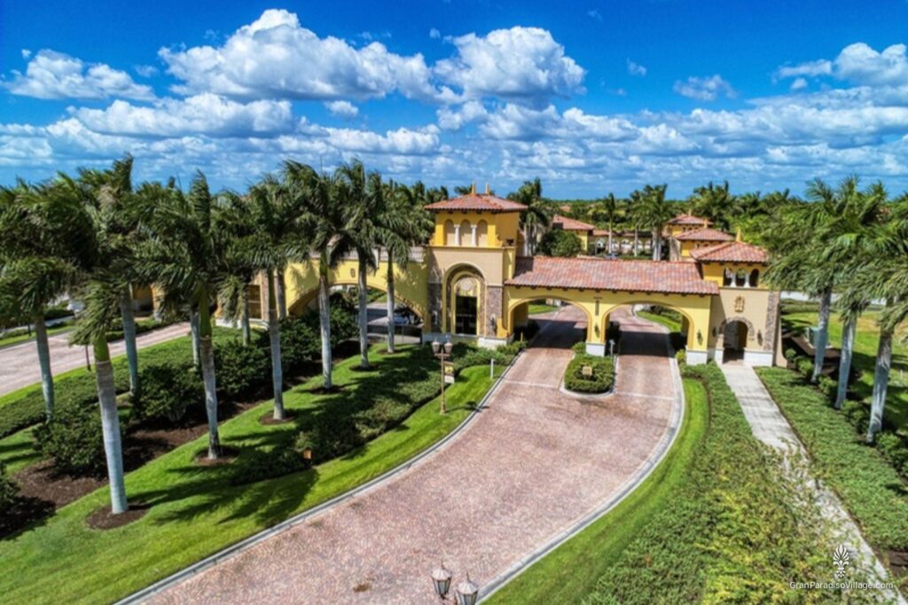 Aerial view of the Gran Paradiso gatehouse and palm-lined entrance drive