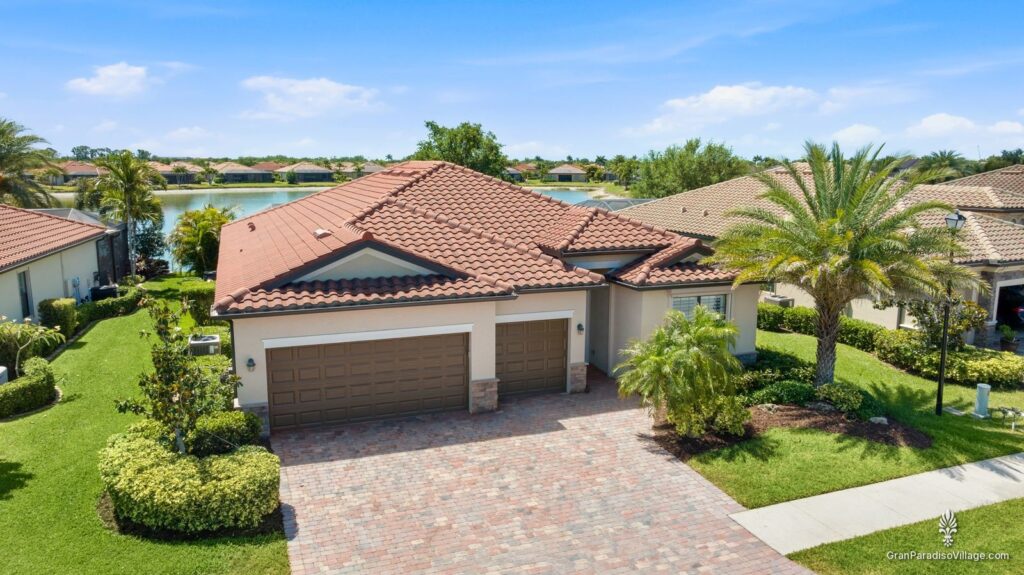Gran Paradiso home with tile roof and lake view
