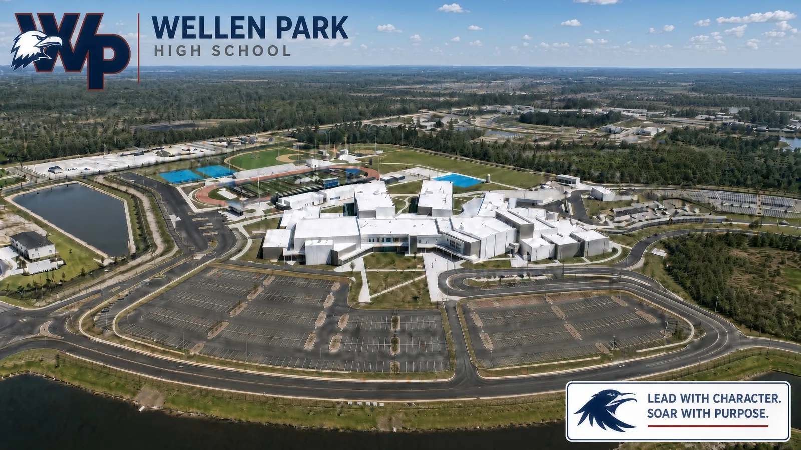 Aerial view of the Wellen Park High School campus, athletic fields and lake in North Port, Florida